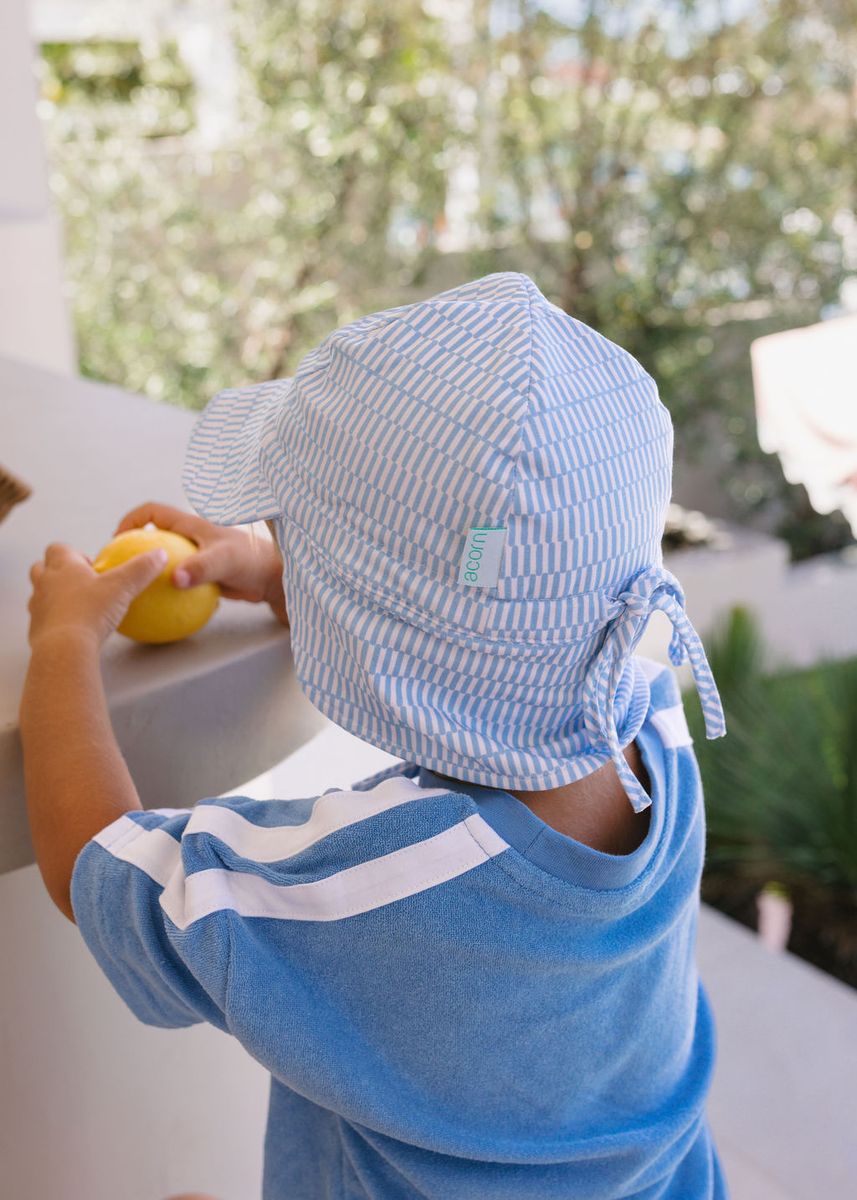 Acorn Kids Blue Sprinkle Soft Jersey Flap Cap in Blue and Cream
