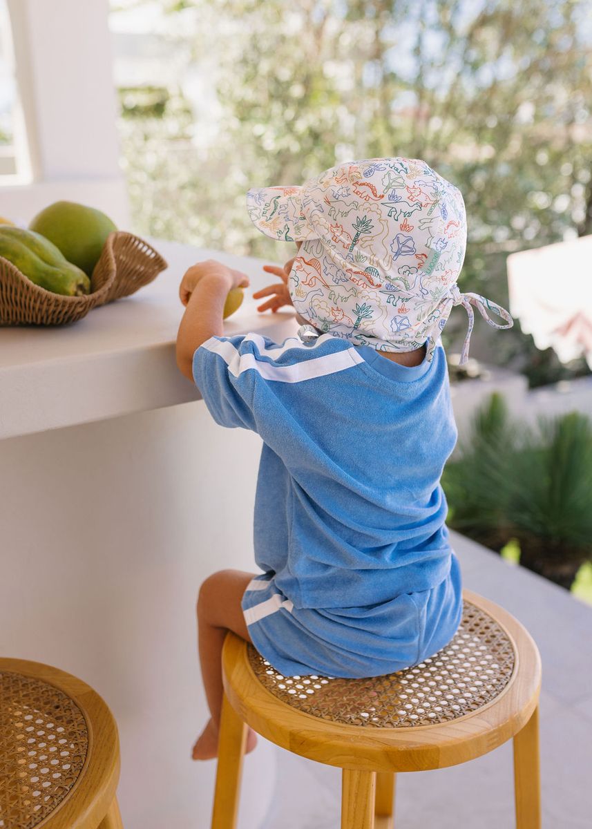 Acorn Kids Dino Soft Jersey Flap Cap in Natural and Multi