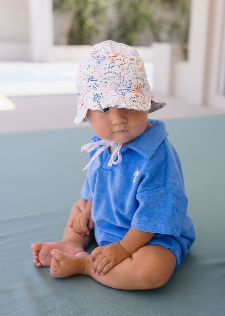Acorn Kids Dino Soft Jersey Flap Cap in Natural and Multi